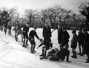School Prints: Orpington boys have a fine slide. These boys at Orpington, Kent, made a fine slide