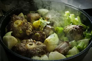 Savoury Collection: Oxtail casserole with onions and celery being started on top of stove before being