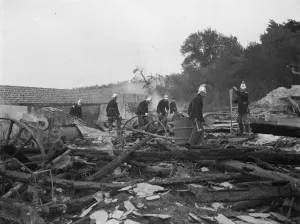 Padham farm fire in Swanley. Fireman work through the charred remains