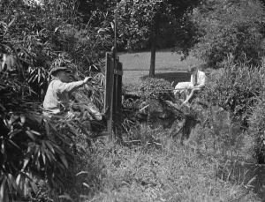 Painting and fishing in the gardens of Oakhill. 1928