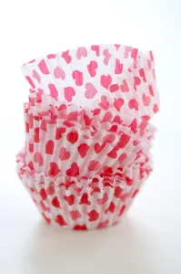 Paper cases for making muffins and fairy cakes - decorated with small red hearts credit