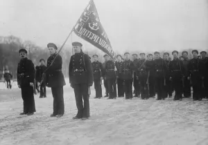 Parade of Bolshhevik Naval men in one of the streets of Petrograd. The flag bears