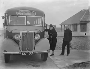 Passengers getting onto a Carey Bros Bedford coach in New Romney, Kent