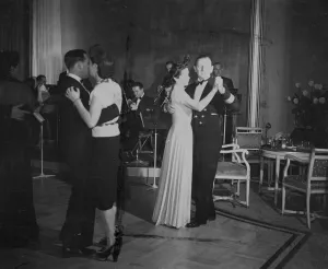 Passengers on the maiden voyage of the HMS Queen Elizabeth luxury liner, dancing