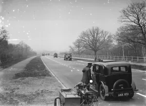 Motor Bike Prints: An a patrolman talking to a motorist on the new Sidcup By - Pass. 1935