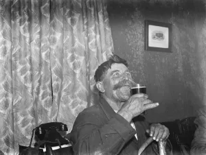 Paying in night at the Rat and Sparrow Club in Eynsford, Kent. Mr Charlie Meadows