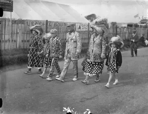 English Prints: Pearly King and Queen at the Derby. A Royal family of Pearlies arriving on
