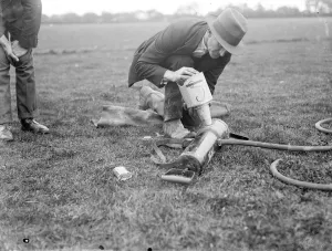 Pest Control Prints: A pest controller prepares a demonstration of cyanogas. 1936