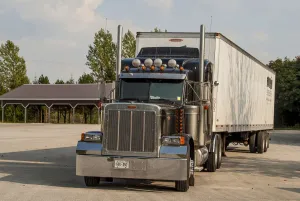 Artic Prints: Peterbilt 6x4 semi tracter unit with a twin axle box trailer in the Blue Mountains