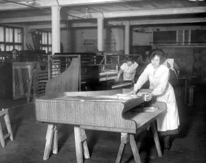 Piano Making at Brinsmeads Factory. Polishing a fine satinwood case. 10 December