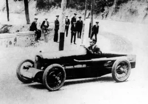 Pierre De Vizcaya - in a Bugatti racing car rounding a corner in 1922