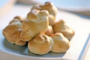 Pile Collection: Pile of freshly baked twisted bread rolls credit: Marie-Louise Avery / thePictureKitchen