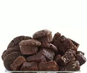 Pile Collection: Pile of organic chocolate muffins and brownies credit: Marie-Louise Avery / thePictureKitchen