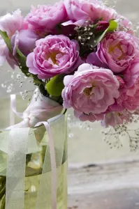 Roses Prints: Pink peonieswith gypsophila tied into simple posy style wedding bouquet credit