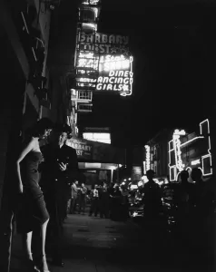Lights Prints: A police officer chats with a woman outside the Barbary Coast Hotel, Las Vegas, Nevada
