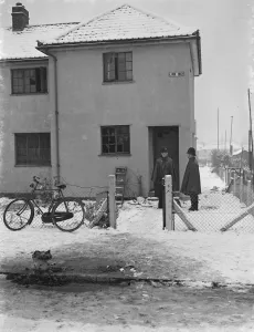 Bobby Prints: Two policemen stand outside a house, the site of a fire tragedy in Bromley, Kent