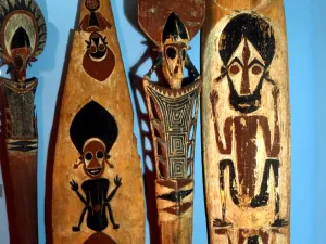 POLYNESIAN MYTHOLOGY Wooden paddles, painted with traditional figures. From