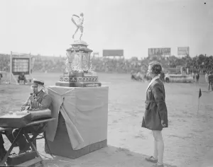 Polytechnic Sports at Stamford Bridge A competitor admiring the marathon trophy 16