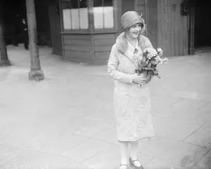 Popular British film star returns from America. Miss Flora le Breton photographed
