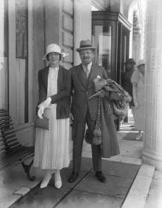 Popular stage star at Cannes Mrs Raymond Pollak with her husband at Cannes. She