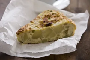 Snack Prints: Potato Tortilla 250gm cooked potatoes (still firm) 1 onion, sliced 1 clove garlic