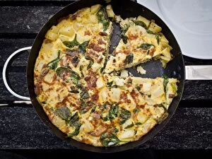 Foods Collection: Prawn and spinach frittata with aluminium foil being wrapped fro a picnic