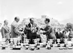 Presenting the Cups: Greek Prime Minister Karamanlis presenting the many prizes