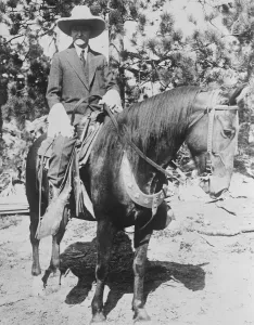 President Coolidge on his favourite mount during his vacation in the Black hills in Dakota