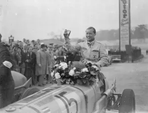 Prince Bira wins international trophy race. Prince Birs of Siam driving an E R
