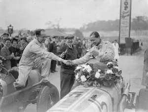 Prince Bira wins international trophy race. Prince Birs of Siam driving an E R