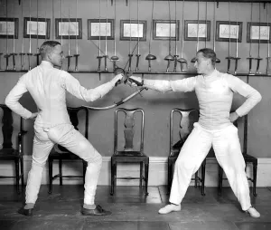 Prince Olaf of Norway (right) taking part in the Oxford V Royal Navy fencing Tournament