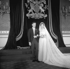 Princess Alexandra of Kent wearing a gown of magnolia tinted lace, embroided with acorns