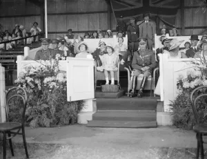 Princess Elizabeth at Aldershot Tattoo. Princess Elizabeth with her parents, the Duke