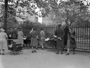 Playing Prints: Princess Elizabeth at play in the garden. Crowds watching - 21 October 1930 ? TopFoto