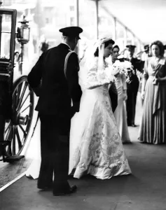 Princess Elizabeth wearing her shimmering pearl encrusted bridal gown arrives