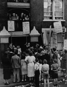 A protest meeting of tenants outside Quinn Square Building Bethnal Green London in
