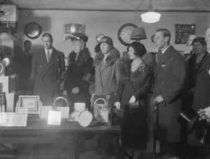 The queen and her children at the British industries fair. The queen accompanied by the Duke