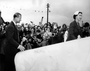 On Board Prints: The Queen and the Duke of Edinburgh smile in response to the delighted crowd cheering