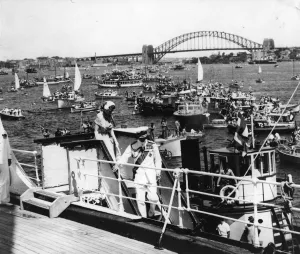 Queen Elizabeth II follows the Duke of Edinburgh down the gangway as the Royal travellers