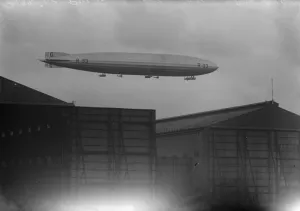 R 33 in taking off trial with two D H 53 Hummingbirds at Pulham. The airship above