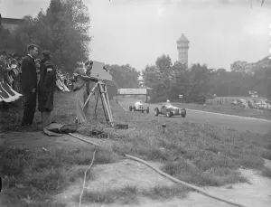 The race being televised in front is count Johnny Lurani the Italian driver in his Maserati
