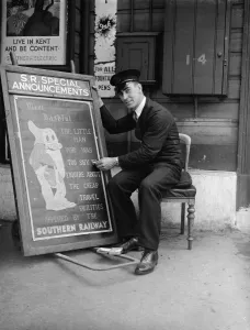 Writing Prints: Railway porter sign writer Mr E A Burgar. 1938