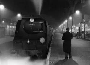 Railway station at night - 1959 Credit: TopFoto