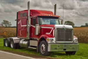 Rural Prints: A red 6x4 Intaenational eagle semi tracter unit for sale by the raod side in rural