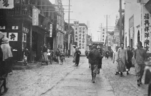 Reported fall of Hangchow. A street in the business quarter of Hangchow. 15 December