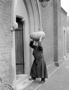 Hallow Prints: Reverend A. W. Barker prepares to decorate his church for annual harvest festival service