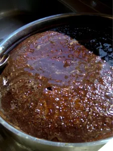 Cooking Prints: Rich sticky chocolate cake baked aboard Turkish gulet being dosed with chocolate