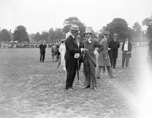 Aristocrats Prints: At the Richmond horse show, the King chatting to Lord Desborough. 10 June 1922