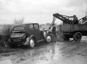 Road Casualties. A Breakdown car at work on a car that skidded on the icy road near Lewes