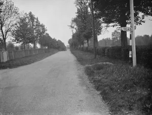 Advertisement Prints: A road sign obscured. 1938